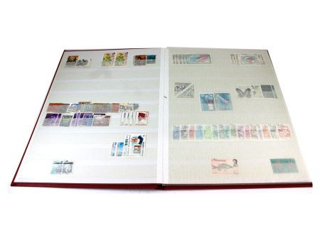 100+ World Stamps Mint Condition in Red Album on Sale